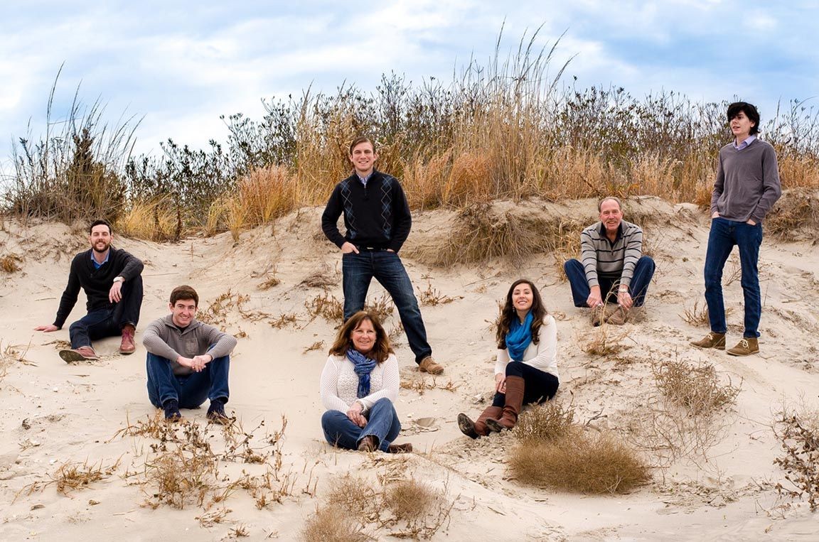 family photo shot in the dunes at the beach